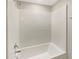 Bathroom with shower/tub combo and tile surround at 4269 Desert Rose Ave, Kissimmee, FL 34746