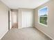 Bright bedroom with double door closet and view at 4269 Desert Rose Ave, Kissimmee, FL 34746