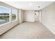 Spacious bedroom with large windows and carpeted floor at 4269 Desert Rose Ave, Kissimmee, FL 34746