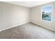 Bright bedroom with water view and carpeted floor at 4269 Desert Rose Ave, Kissimmee, FL 34746