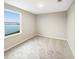 Bright bedroom with lake view and neutral colored carpet at 4269 Desert Rose Ave, Kissimmee, FL 34746