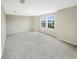 Spacious bedroom with carpeted floor and large windows at 4269 Desert Rose Ave, Kissimmee, FL 34746