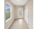 Bright entryway with tile flooring and a glass-paned front door at 4269 Desert Rose Ave, Kissimmee, FL 34746