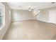 Large living room with tile floors and lots of natural light at 4269 Desert Rose Ave, Kissimmee, FL 34746