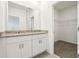 Bathroom boasts a double vanity with granite countertop and walk-in closet at 4630 Homestead Trl, St Cloud, FL 34772