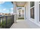 Covered front porch with black railing and a view of the neighborhood at 4630 Homestead Trl, St Cloud, FL 34772