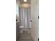 Clean bathroom with shower/tub combo, gray vanity, and patterned shower curtain at 4726 Combahee Ln, Orlando, FL 32837