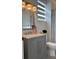 Modern bathroom with gray vanity, marble countertop, and updated fixtures at 4726 Combahee Ln, Orlando, FL 32837
