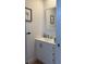White vanity with brushed nickel fixtures in an updated bathroom at 4726 Combahee Ln, Orlando, FL 32837