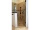 Walk-in shower with tiled walls and handheld shower head at 4726 Combahee Ln, Orlando, FL 32837