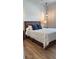 Bedroom with wood platform bed and neutral decor at 4726 Combahee Ln, Orlando, FL 32837