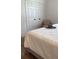 Main bedroom with king bed, textured bedding, and large closet at 4726 Combahee Ln, Orlando, FL 32837