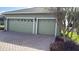Two-car garage with decorative paver driveway at 4726 Combahee Ln, Orlando, FL 32837