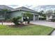 Two-car garage with paver driveway and landscaping at 4726 Combahee Ln, Orlando, FL 32837