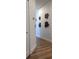 Bright hallway with wood floors and unique wall art at 4726 Combahee Ln, Orlando, FL 32837
