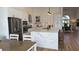 Modern kitchen with white shaker cabinets, quartz countertops and stainless steel appliances at 4726 Combahee Ln, Orlando, FL 32837
