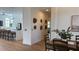 Open concept kitchen and dining area with modern kitchen island and hardwood floors at 4726 Combahee Ln, Orlando, FL 32837