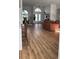 Spacious living room with hardwood floors and view into dining area and entryway at 4726 Combahee Ln, Orlando, FL 32837
