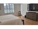 Main bedroom with large TV, dresser, and access to backyard at 4726 Combahee Ln, Orlando, FL 32837