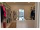 Custom walk-in closet with built-in shelves, drawers, and island at 4726 Combahee Ln, Orlando, FL 32837