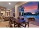Outdoor dining area with pool and sunset view at 5251 Carson St, St Cloud, FL 34771