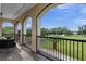 Covered balcony overlooking a lush green backyard at 5251 Carson St, St Cloud, FL 34771