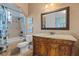 Elegant bathroom with granite vanity, soaking tub, and decorative tile at 5251 Carson St, St Cloud, FL 34771