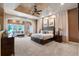 Bright main bedroom with a king-size bed and sitting area at 5251 Carson St, St Cloud, FL 34771