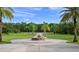 Long driveway leading to home with fountain and palm trees at 5251 Carson St, St Cloud, FL 34771