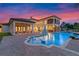 Stunning pool and patio area with outdoor seating at sunset at 5251 Carson St, St Cloud, FL 34771