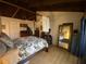 Spacious bedroom with a four-poster bed and private balcony access at 5302 Burning Tree Dr # F-02-2, Orlando, FL 32811