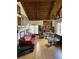 Bright living room with hardwood floors, comfy seating, and large artwork at 5302 Burning Tree Dr # F-02-2, Orlando, FL 32811