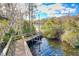 Wooden walkway leading to a tranquil lake at 632 Long Lake Dr, Oviedo, FL 32765