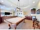 Game room features a pool table, wet bar, and seating at 632 Long Lake Dr, Oviedo, FL 32765