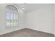 Bright bedroom with wood-look flooring and plantation shutters at 693 Rochester Ct, New Smyrna Beach, FL 32168