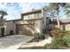 Front view of tan two-story townhouse with garage at 706 Drywood Ave, Fern Park, FL 32730