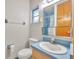 Bathroom with light blue tile and built-in vanity at 747 Mcintyre Ave, Winter Park, FL 32789