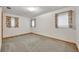 Spacious bedroom with carpet and two windows at 747 Mcintyre Ave, Winter Park, FL 32789