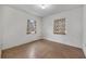 Simple bedroom with two windows and tile flooring at 747 Mcintyre Ave, Winter Park, FL 32789