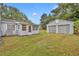 House exterior with detached garage and backyard at 747 Mcintyre Ave, Winter Park, FL 32789