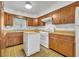 Retro kitchen with wood cabinets and a dishwasher at 747 Mcintyre Ave, Winter Park, FL 32789