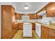 Retro kitchen with wood cabinets and a dishwasher at 747 Mcintyre Ave, Winter Park, FL 32789