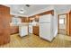 Retro kitchen with wood cabinets and a dishwasher at 747 Mcintyre Ave, Winter Park, FL 32789