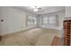 Bright living room featuring a fireplace and large windows at 747 Mcintyre Ave, Winter Park, FL 32789