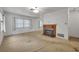 Spacious living room with a brick fireplace at 747 Mcintyre Ave, Winter Park, FL 32789