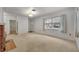 Living room with fireplace and view into kitchen at 747 Mcintyre Ave, Winter Park, FL 32789