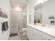Clean bathroom with a walk-in shower and white cabinets at 7518 Sw 77Th Ave, Ocala, FL 34481