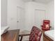Bedroom with red recliner chair and built-in closet at 7518 Sw 77Th Ave, Ocala, FL 34481
