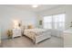 Bright bedroom with a queen-size bed and a dresser at 7518 Sw 77Th Ave, Ocala, FL 34481