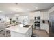 Modern kitchen with white cabinets, stainless steel appliances, and an island at 7518 Sw 77Th Ave, Ocala, FL 34481
